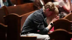 A mourner at church