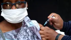 A woman is jabbed in South Africa