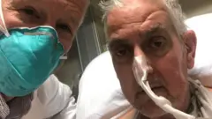 Surgeon Bartley P Griffith with David Bennett in January