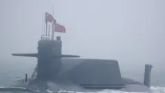 A new type 094A Jin-class nuclear submarine Long March 10 of the Chinese People's Liberation Army (PLA) Navy participates in a naval parade to commemorate the 70th anniversary of the founding of China's PLA Navy in the sea near Qingdao, in eastern China's Shandong province on April 23, 2019. -