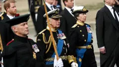 King Charles III and Anne, Princess Royal follow behind The Queen's funeral cortege borne on the State Gun Carriage of the Royal Navy as it leaves Westminster Abbey on September 19, 2022 in London