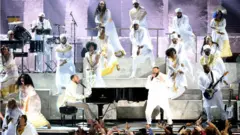 ኽብሪ ኒፕሲ ሃስል ዝቐረበ ሙዚቃዊ ምርኢት፡ እቶም ተለሃይቲ ዙርያ ተኸዲኖም እናሳዕስዑ