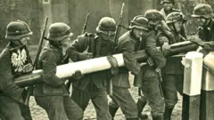 German troops removing a Polish border barrier during the invasion on 1 September 1939
