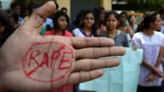Indian students of Saint Joseph Degree college participate during an anti-rape protest in Hyderabad on September 13, 2013. An Indian judge will consider the sentences for four men found guilty of the brutal gang rape and murder of an Indian student on a bus, as the victim's family leads calls for them to be hanged. AFP PHOTO / Noah SEELAM / AFP PHOTO / Noah SEELAM (Photo credit should read NOAH SEELAM/AFP via Getty Images)