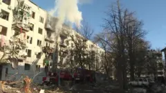 Smoke emerges from residential building after bombing