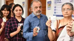Voters standing in the queue to cast their votes, at a polling booth, during the 2nd Phase of #GeneralElections2019 at Chennai, Tamil Nadu