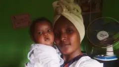 አልማዝ ከልጇ ጋር