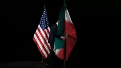العلمان الأمريكي والإيراني