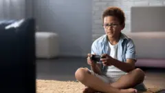 A boy playing a videogame