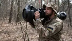 Oleg demonstrates firing the MBT-NLAW (Next generation Light Anti-tank Weapon) provided by the United Kingdom