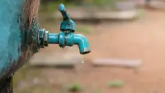 A water tap with a water drop