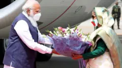 শেখ মুজিবুর রহমানের জন্মশতবার্ষিকী ও বাংলাদেশের স্বাধীনতার ৫০ বছর পূর্তির অনুষ্ঠানমালায় যোগ দিতে ঢাকায় এসেছেন নরেন্দ্র মোদী।