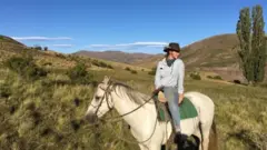 Annabel Symes poses on horseback