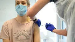 Woman receives a Covid-19 vaccination booster jab, London, November 2021