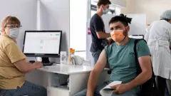 Эмланаётган мигрант