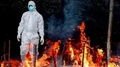 తండ్రి చితిమంటల్లో దూకిన కూతురు