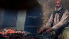 कबाब सेकता व्यक्ति