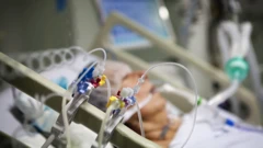 Patient being ventilated with oxygen