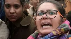 A woman reacts as she confronts police at a demonstration against Indias new citizenship law in New Delhi on December 19, 2019