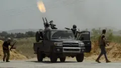 A truck firing a machinegun