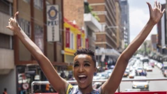 Miss Universe Zozibini Tunzi waving aboard an open-topped bus in Johannesburg, South Africa - Thursday 13 February 2020