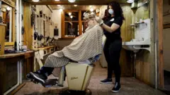 Hairdresser Robert Verhulst and his staff prepare and practice for a possible reopening of his business in Gouda
