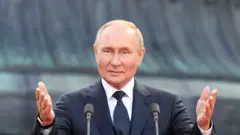 путін