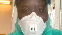 Infirmiere Khady Ndoye avec equipement de protection