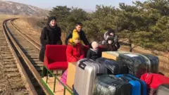 Russian diplomats on hand pushed trolley