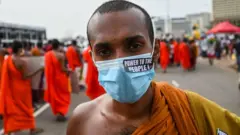 Buddhist monks participate in an anti-government demonstration outside the President's office in Colombo on May 3, 2022, demanding President Gotabaya Rajapaksas resignation over the country's crippling economic crisis.