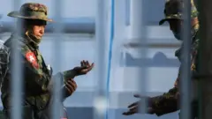 Myanmar soldiers are seen inside City Hall in Yangon, Myanmar February 1, 2021
