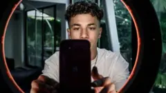 French TikToker Rafael Caplan recording a video