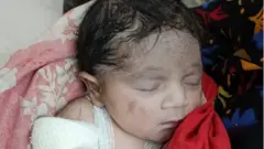 নবজাতক শিশুটি