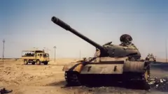 Burnt-out tank in Basra, Iraq, in 2003