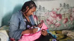 ጠይባ ከልጇ ጋር