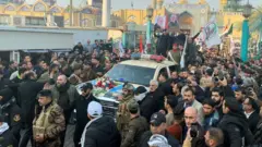 People gather at the funeral of the Iranian Major-General Qassem Soleimani, top commander of the elite Quds Force of the Revolutionary Guards, and the Iraqi militia commander Abu Mahdi al-Muhandis
