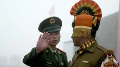 File photo of an Indian and Chinese soldier on the border
