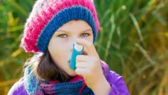 girl using an inhaler