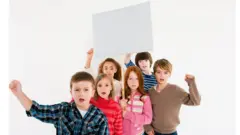 Children protesting with placard