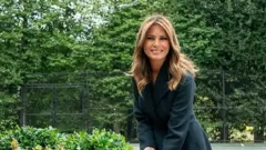 First Lady Melania Trump turns soil with a ceremonial shovel at the groundbreaking ceremony for the White House Tennis Pavilion on 8 October 2019