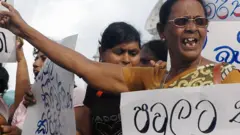 Sri Lankan main opposition United National Party members shout anti-government slogans protesting against rising living costs in Colombo, 03 August 2007.