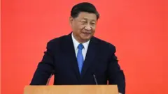 China"s President Xi Jinping speaks upon his arrival via high-speed rail, ahead of the 25th anniversary of the former British colony"s handover to Chinese rule, in Hong Kong, China June 30, 2022.