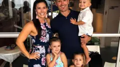 Hannah and Rowan Baxter and their children