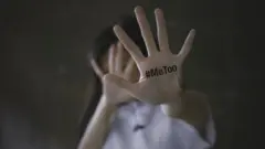 A woman showing her hand with the MeToo slogan
