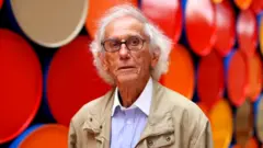 Bulgarian artist Christo poses in front of the monumental "Mastaba" artwork at the Maeght Foundation on the opening day of the exhibition, in Saint-Paul-de-Vence, France, 4 June 2016