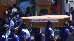 Coffin with "sri lanka economy" written on it