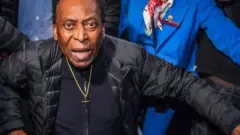 A wheelchair-bound Pele last year