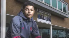 Marcus Rashford outside Ashton on Mersey Sixth Form