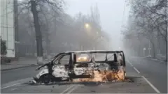 A vehicle that was burned during the protests in Almaty on 6 January