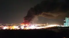 Smoke rises above the Crocus City Hall concert